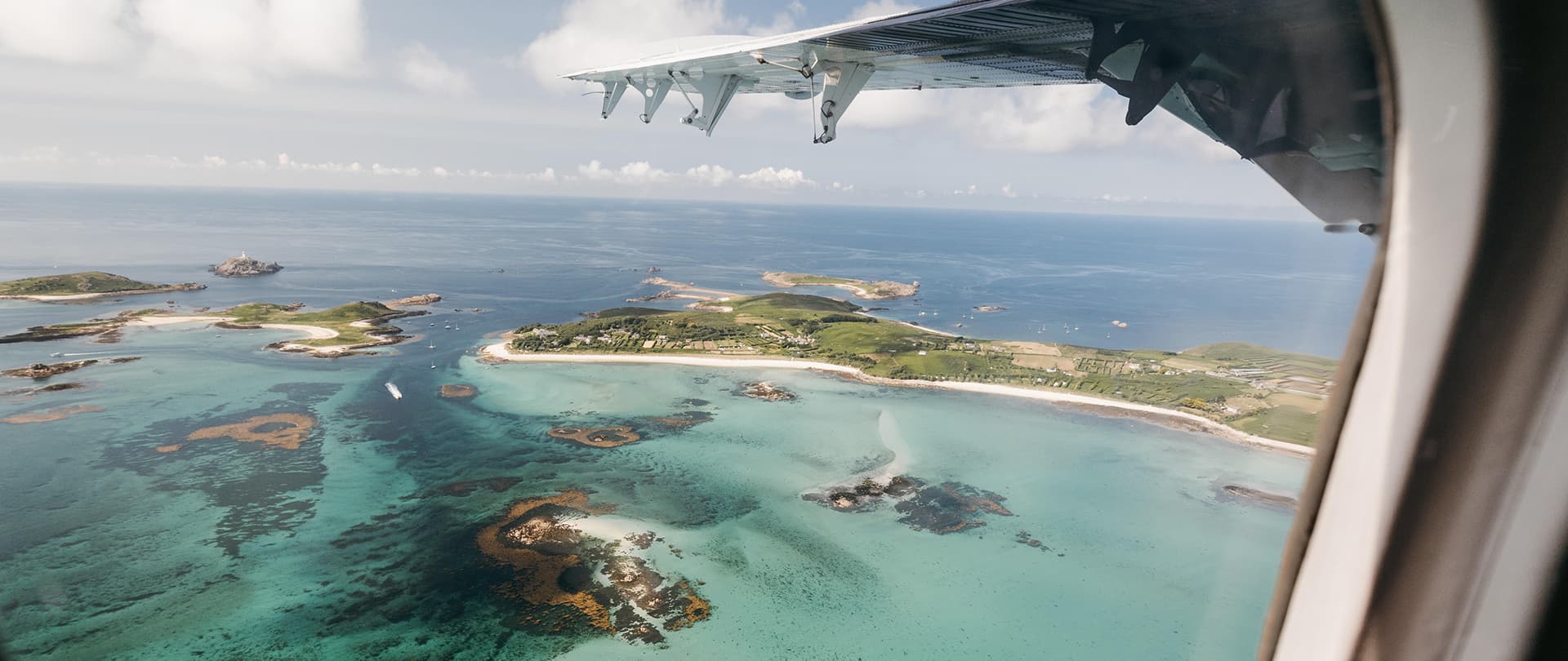 view of the islands Tean and St Martin's from a Skybus Twin Otter