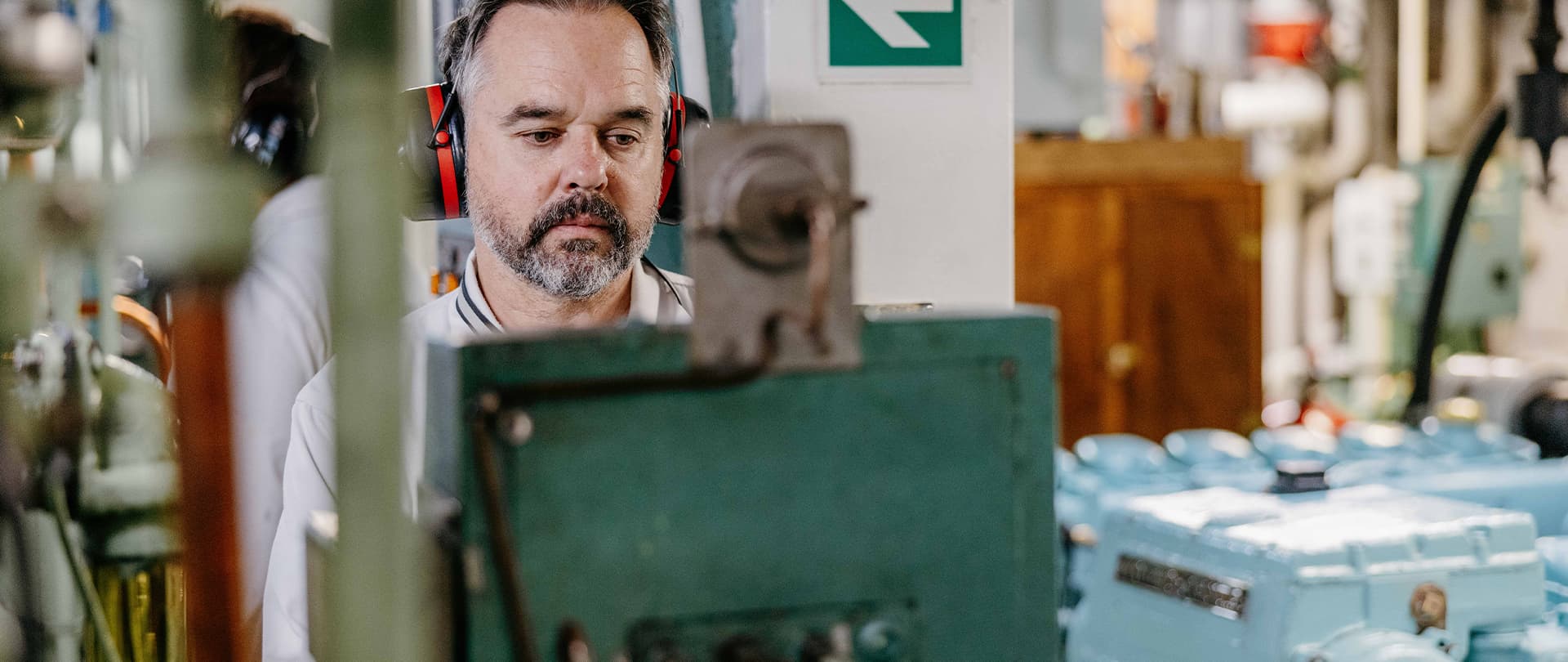 marine engineer completing crucial paperwork in the engine room on Scillonian III
