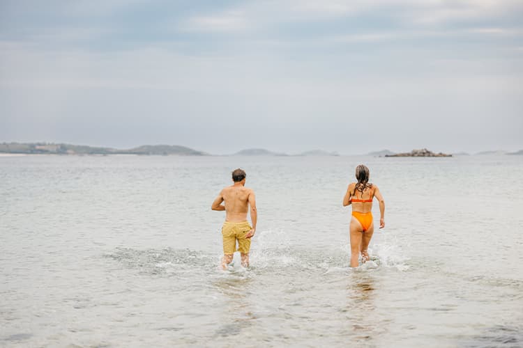 Couple in the sea at Pentle Bay, Tresco - Isles of Scilly