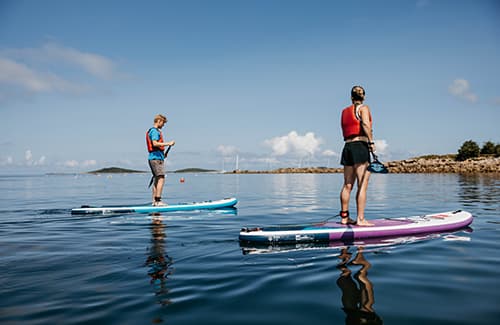 Couple paddle boarding - Porthmellon, St Mary's, Isles of Scilly