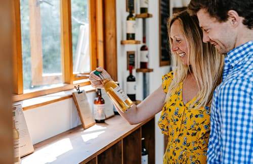 Couple in the St Martin's vineyard shop - Isles of Scilly