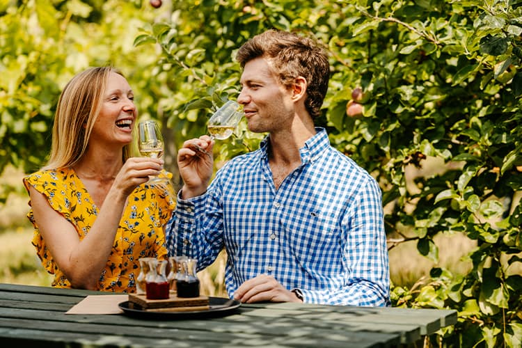 Couple wine tasting at St Martin's Vineyard - Isles of Scilly