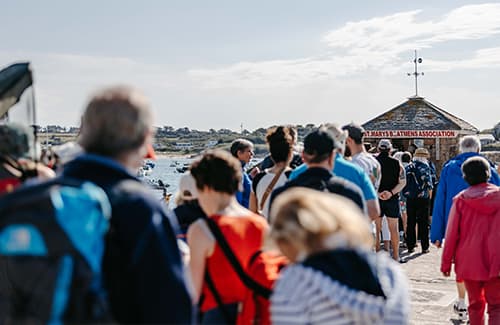 People queuing for St Mary's Boatmen Association tickets on St Mary's Harbour - Isles of Scilly