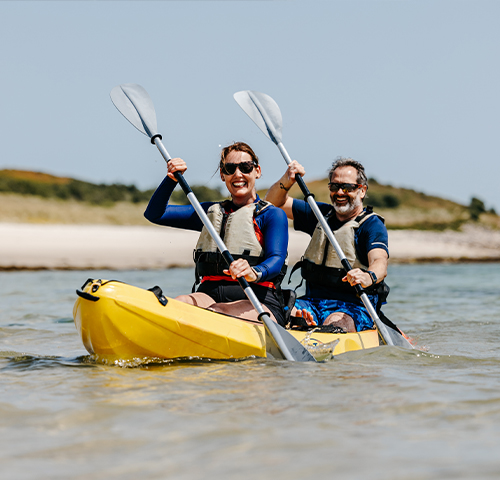 St Martin's Watersports - couple kayaking - Par Beach, Higher Town, St martin's