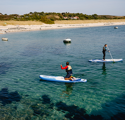St Martin's Watersports - friends paddle boarding - Par Beach, Higher Town, St martin's