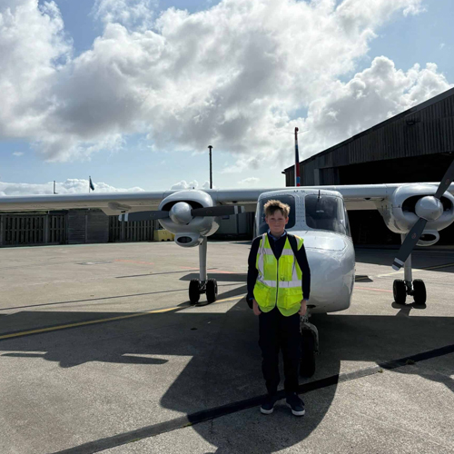 Harry standing infront of a SKybus Islander freighter at Land's End Airport